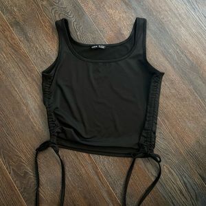 Black cropped tank with gathered side detail